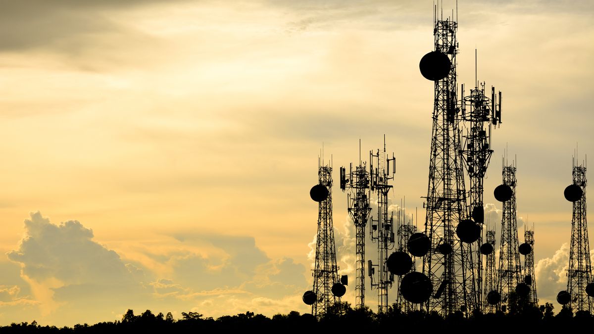 Silhouette of telecoms infrastructure against the sunset