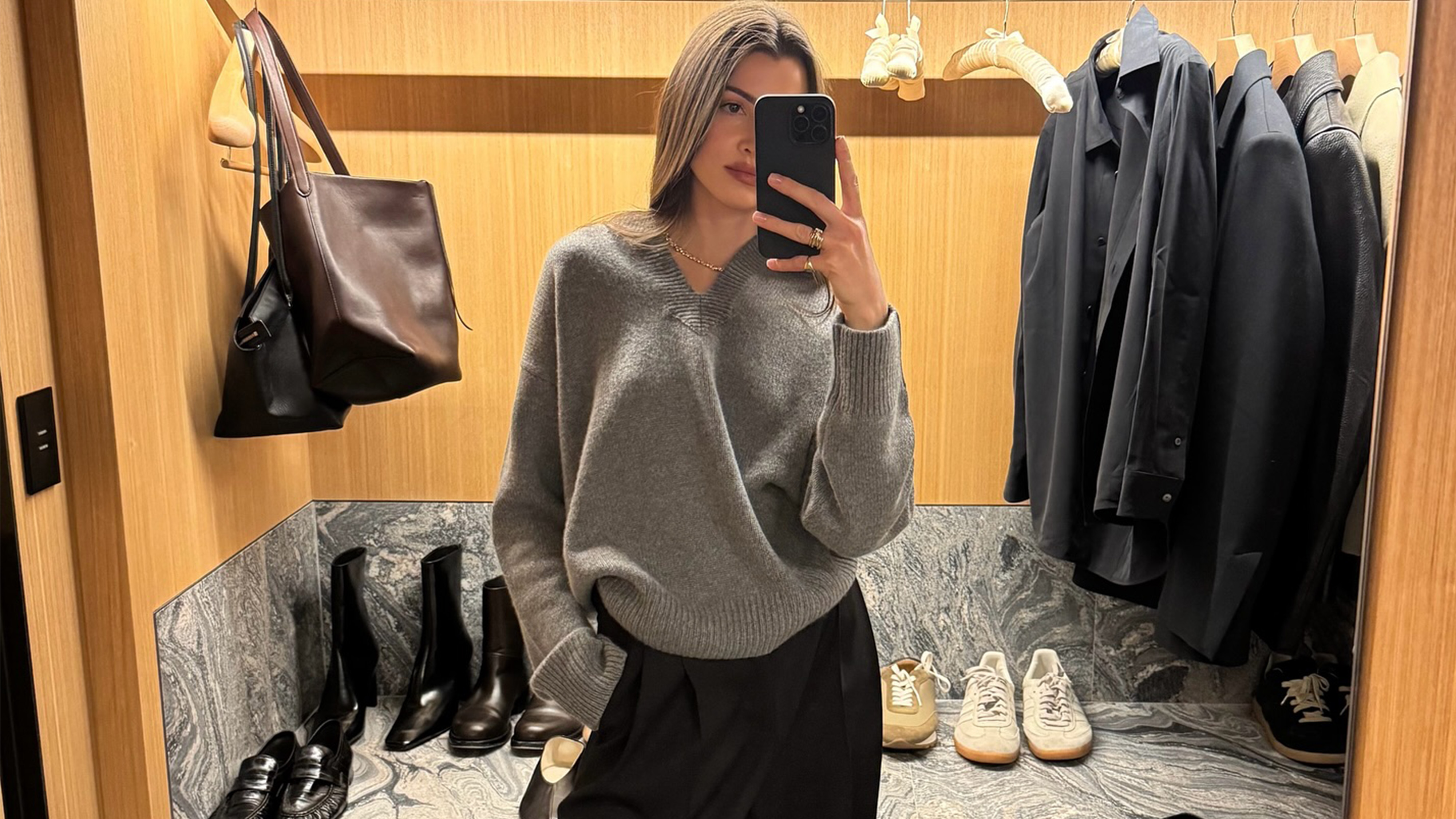 Anna Porte wearing a v-neck sweater.