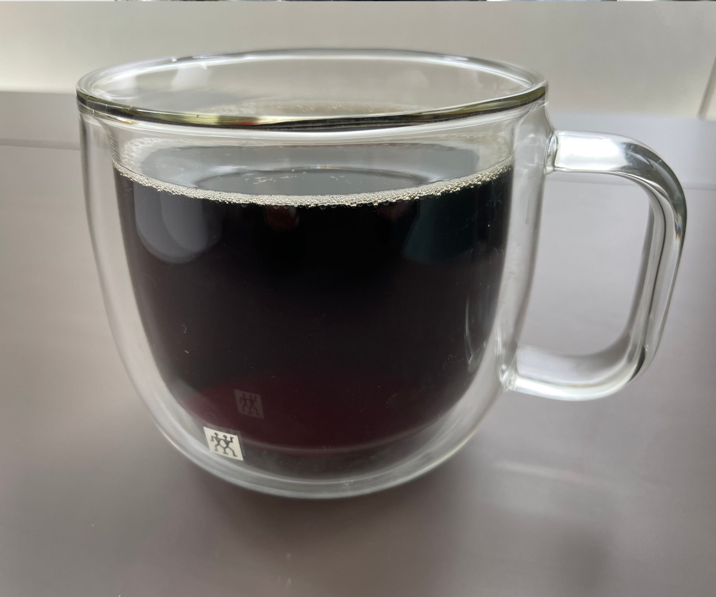 A cup of coffee made using The Ultimate AeroPress Recipe