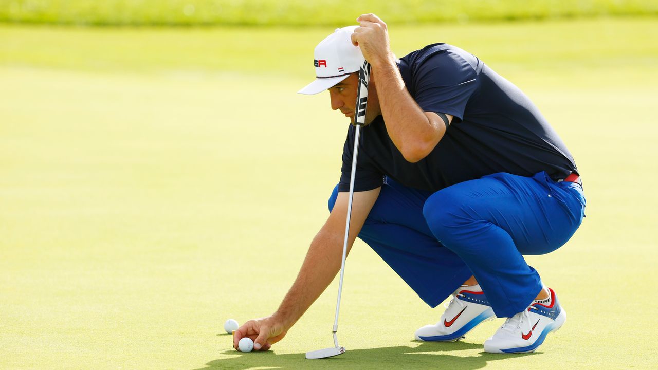 Scottie Scheffler of Team United States lines up a putt in the practice area prior to the 2023 Ryder Cup at Marco Simone