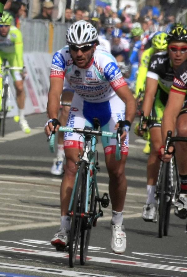 Roberto Ferrari (Androni-Venezuela) brought down Mark Cavendish.