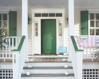 porch with green front door and steps