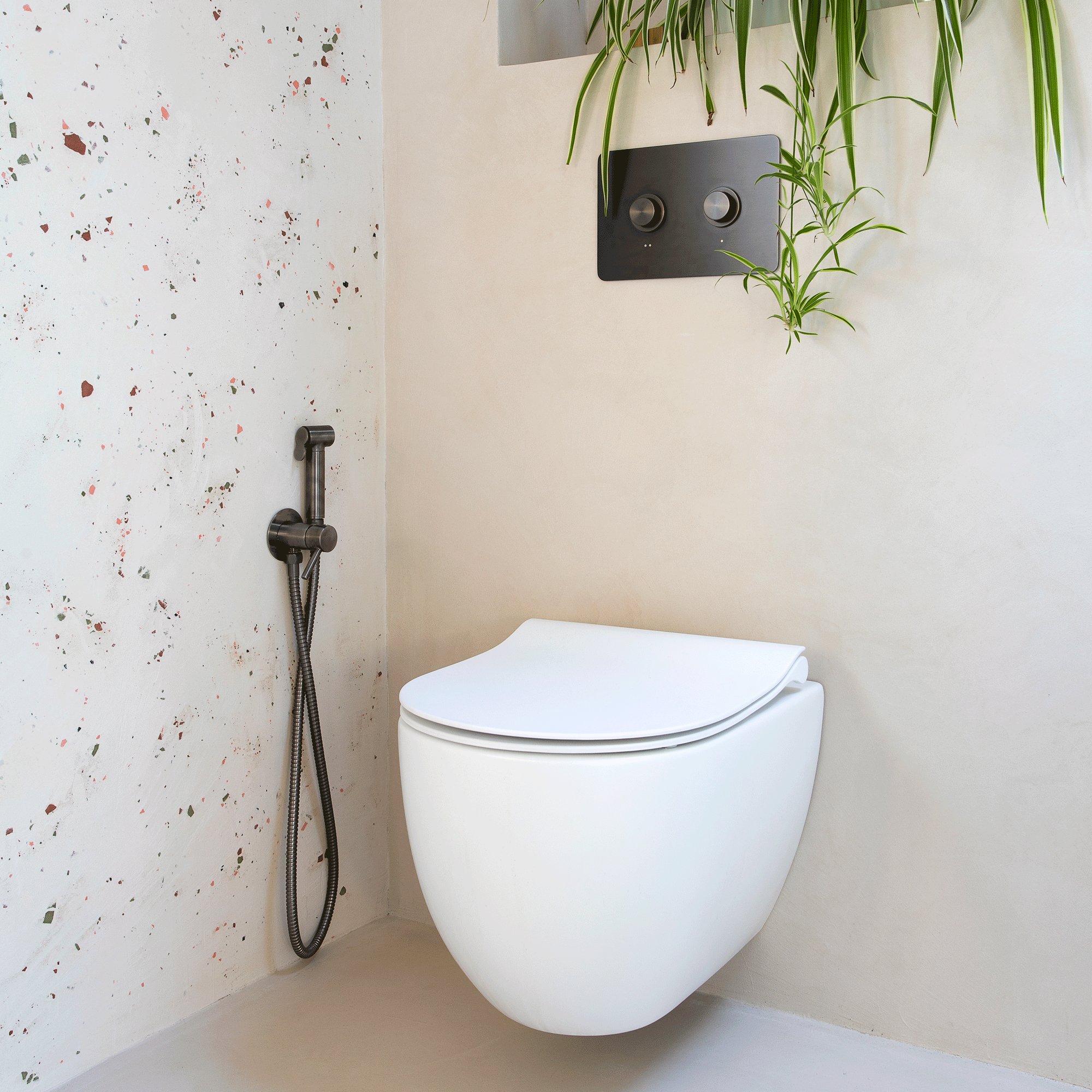 a bathroom with a wall hung loo