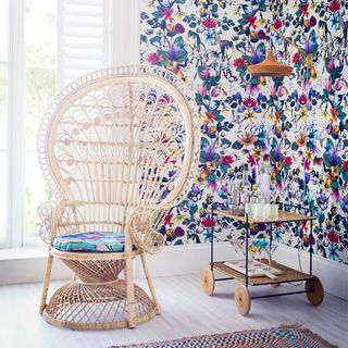 floral wallpaper and peacock chair