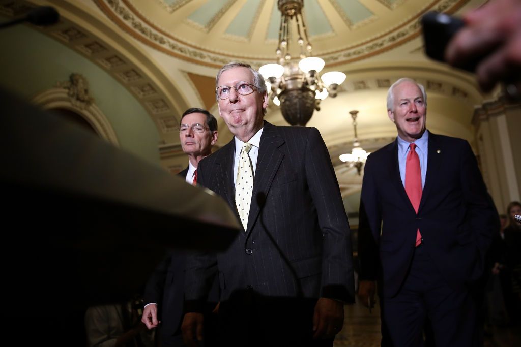 Mitch McConnell arrives at a press conference.