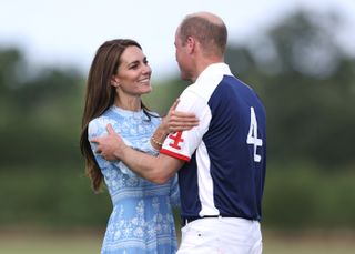 Prince William and Kate Middleton kissing at polo