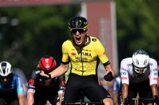 Olav Kooij celebrates his victory on stage nine of the Giro d'Italia
