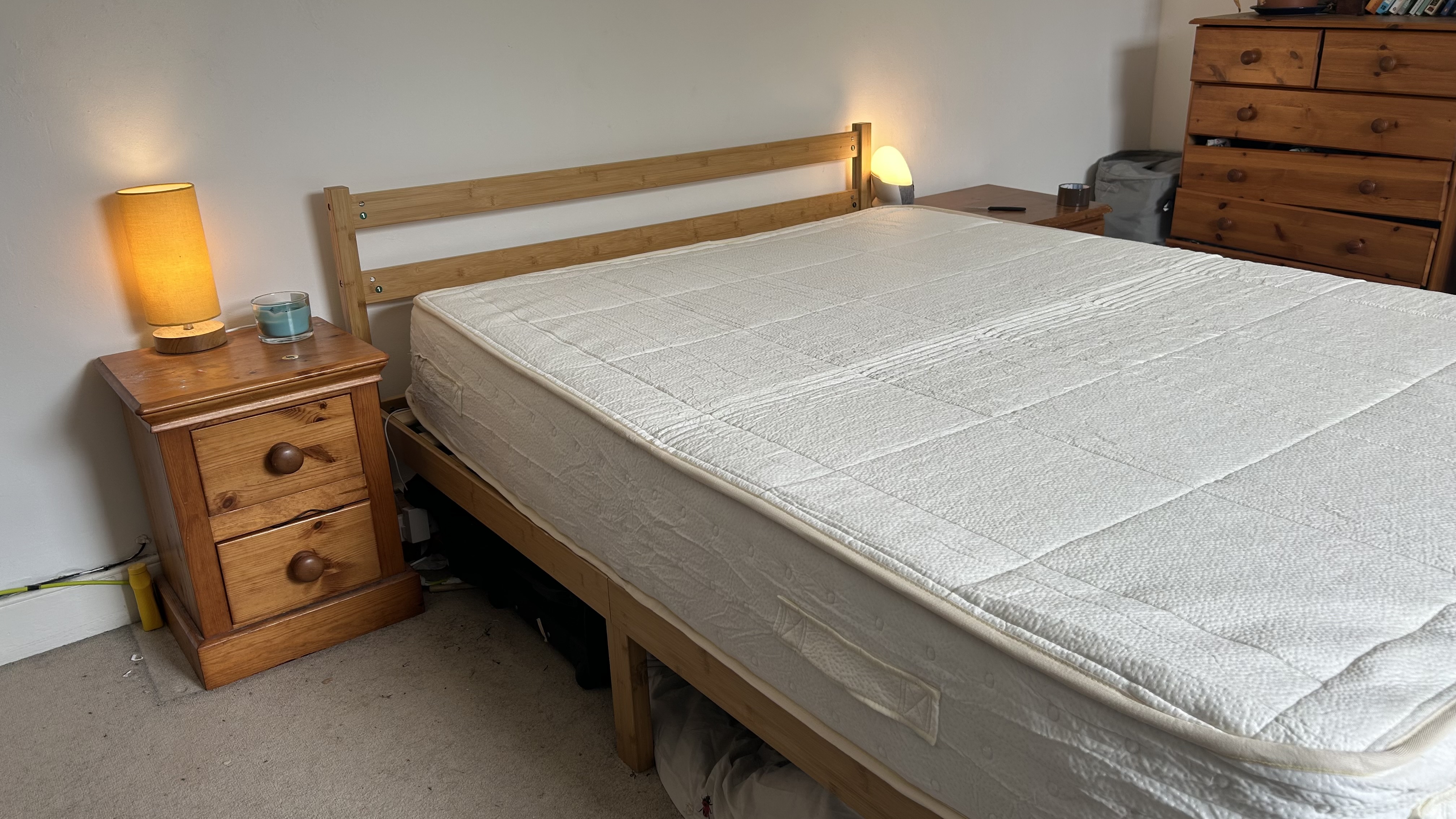 The Awara Classic mattress fully expanded on a wooden bed frame