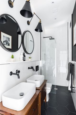 Bathroom with double sinks and walk in shower