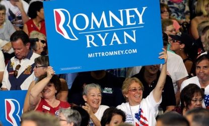 Supporters cheer for Mitt Romney during a campaign event in Las Vegas, Nev.
