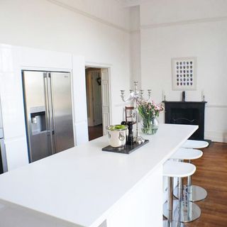 white kitchen worktop and refrigerator