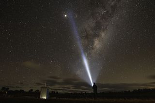 A man looks towards the supermoon and the milky way on May 26, 2021 in Rylstone, Australia in this image by photographer Mark Evans for Getty Images.