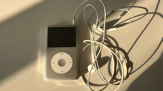 iPod Classic connected to EarPods and charging cable