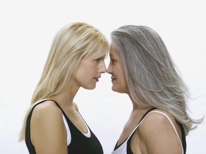 mom and daughter facing off