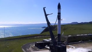 The Rocket Lab Electron booster carrying an Astro Digital satellite stands atop its Mahia Peninsula launch site in New Zealand during a wet rehearsal for an Oct. 14, 2019 launch.