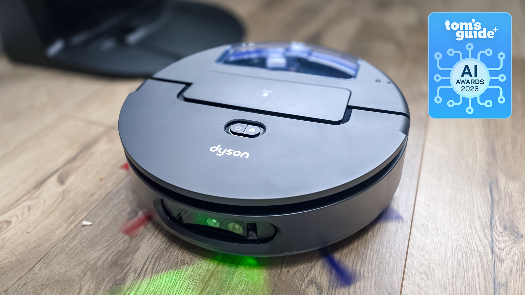 The Dyson Spot+Scrub AI cleaning a floor with a Tom's Guide AI Awards 2026 badge