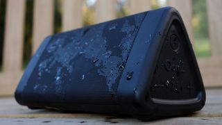 Cambridge SoundWorks OontZ Angle 3 Ultra speaker covered in water droplets