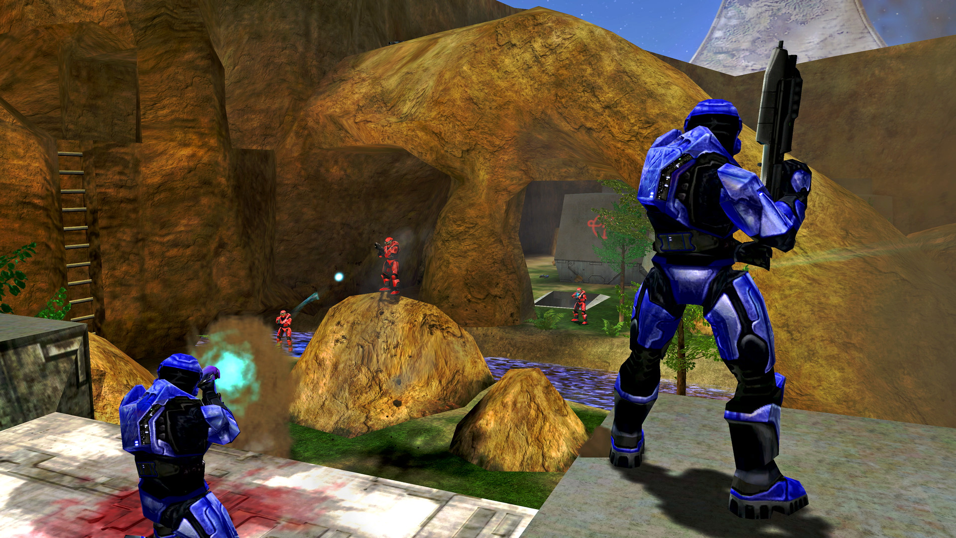 Halo Combat Evolved Anniversary: A screenshot of multiplayer gameplay, showing two blue spartans in the foreground firing at a group of red spartans in the distance.