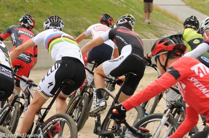 Riders making a difficult 180-degree turn soon after the start