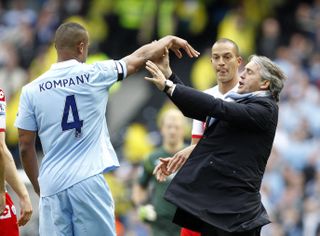 City manager Roberto Mancini (right) argued with players as the pressure increased