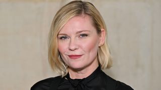 Kirsten Dunst smiling at the camera.