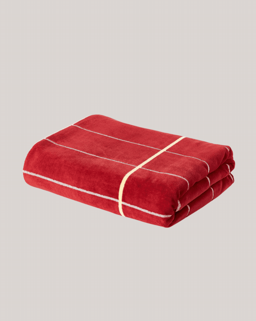 Ivone XL Beach Towel with Stripes against pale beige background.