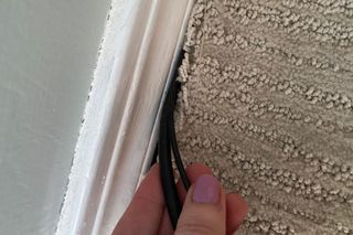 Hiding lamp cords under carpet