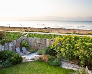 coastal garden with bespoke fencing and seating area