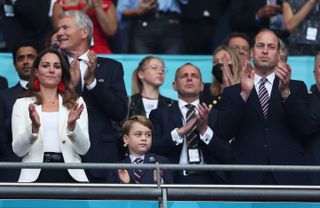 Catherine, Duchess of Cambridge, Prince George of Cambridge and Prince William, Duke of Cambridge and President of the Football Association applaud during the UEFA Euro 2020 Championship Final between Italy and England at Wembley Stadium on July 11, 2021 in London, England