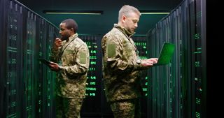 Military IT professionals in a server room