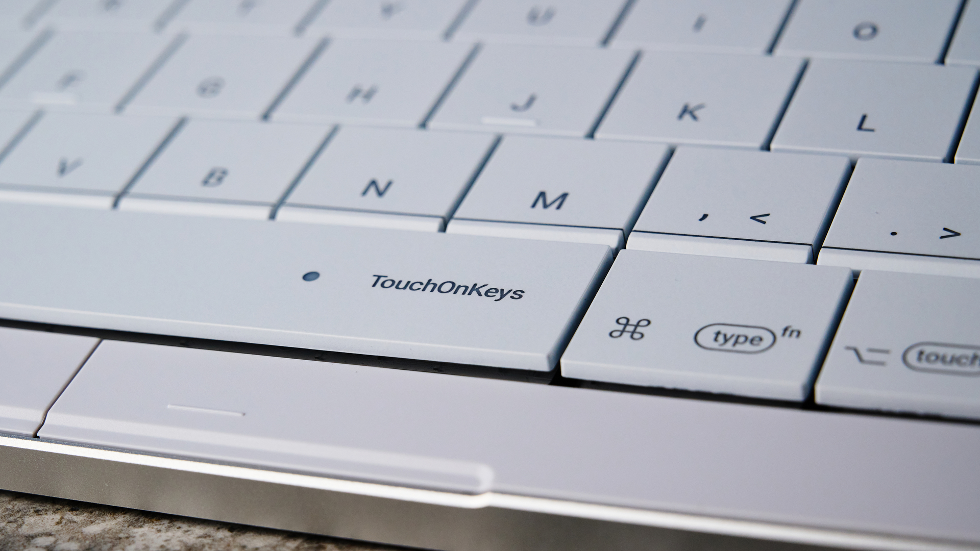 A white Clevetura CLVX S keyboard