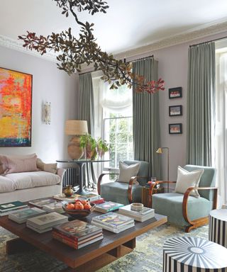 living room with seating area and coffee table and floral chandelier