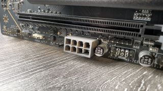 A photo of an MSI MAG X870 Tomahawk WiFi motherboard, focused on its additional 8-pin PCIe power connector