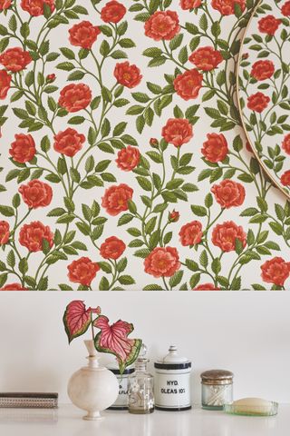 detail of rose wallpaper and dressing table top