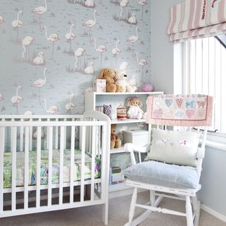 kids room with printed wallpaper on wall and white cabin bed