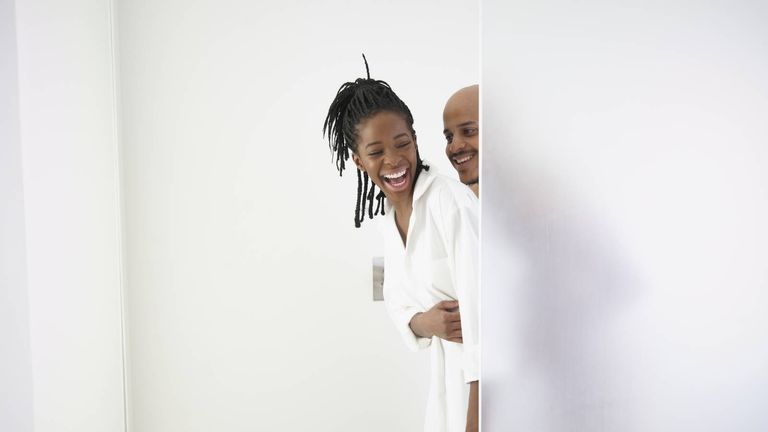 couple laughing together in the shower