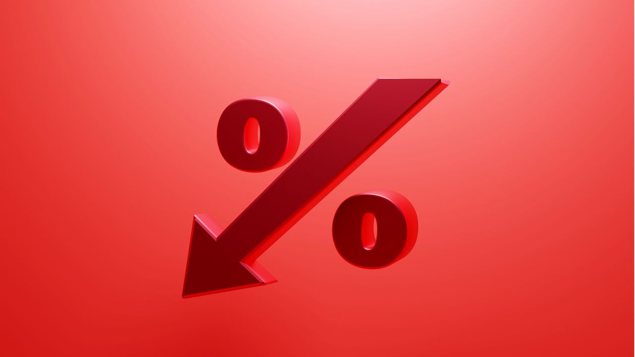 A percentage sign in which the slash mark is a down arrow, against a red background.