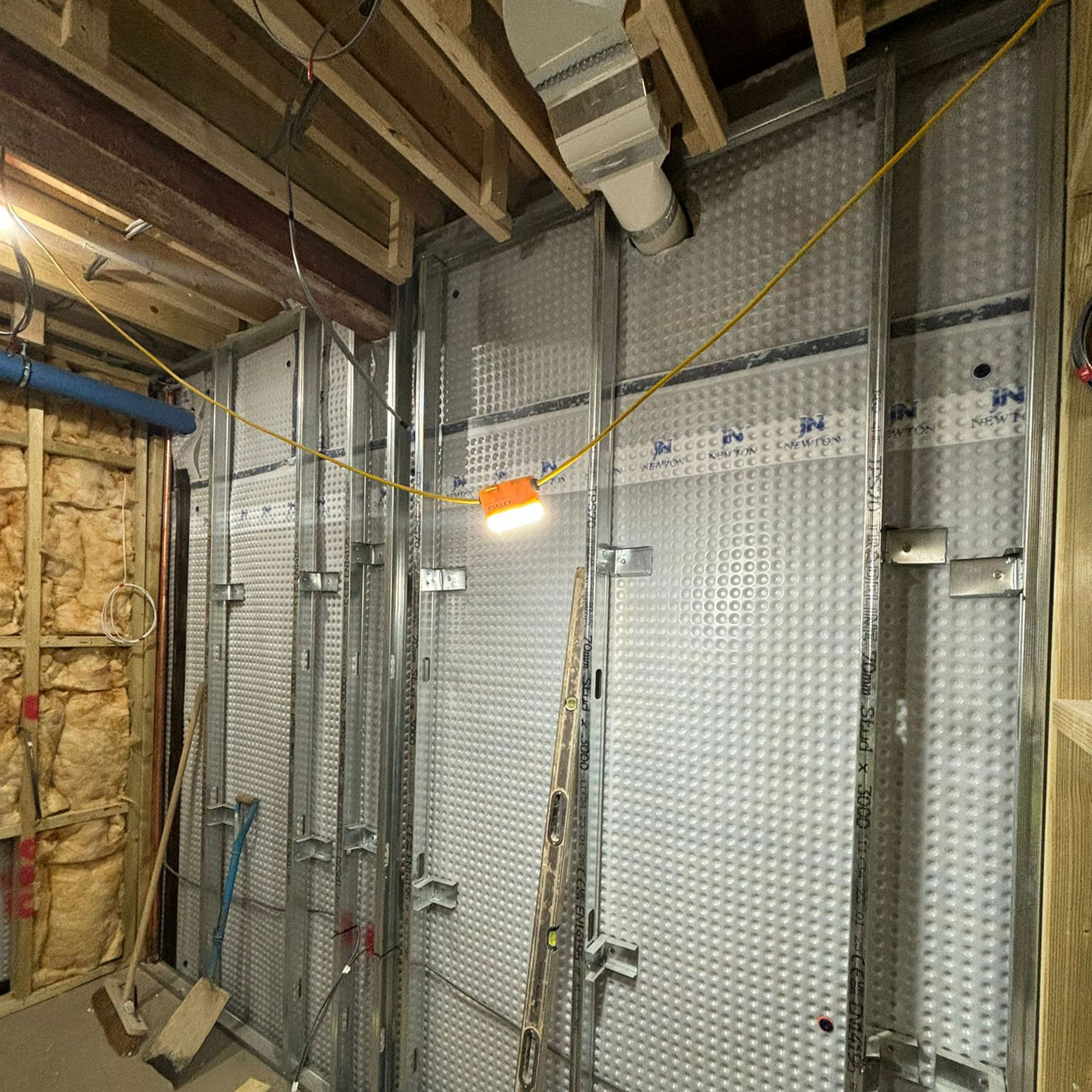 basement waterproofing in progress