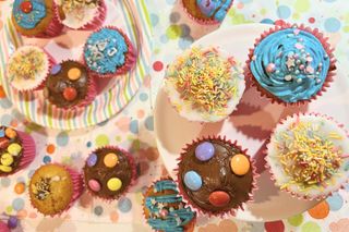 Close up of cupcakes decorated with buttercream chocolate and icing mix