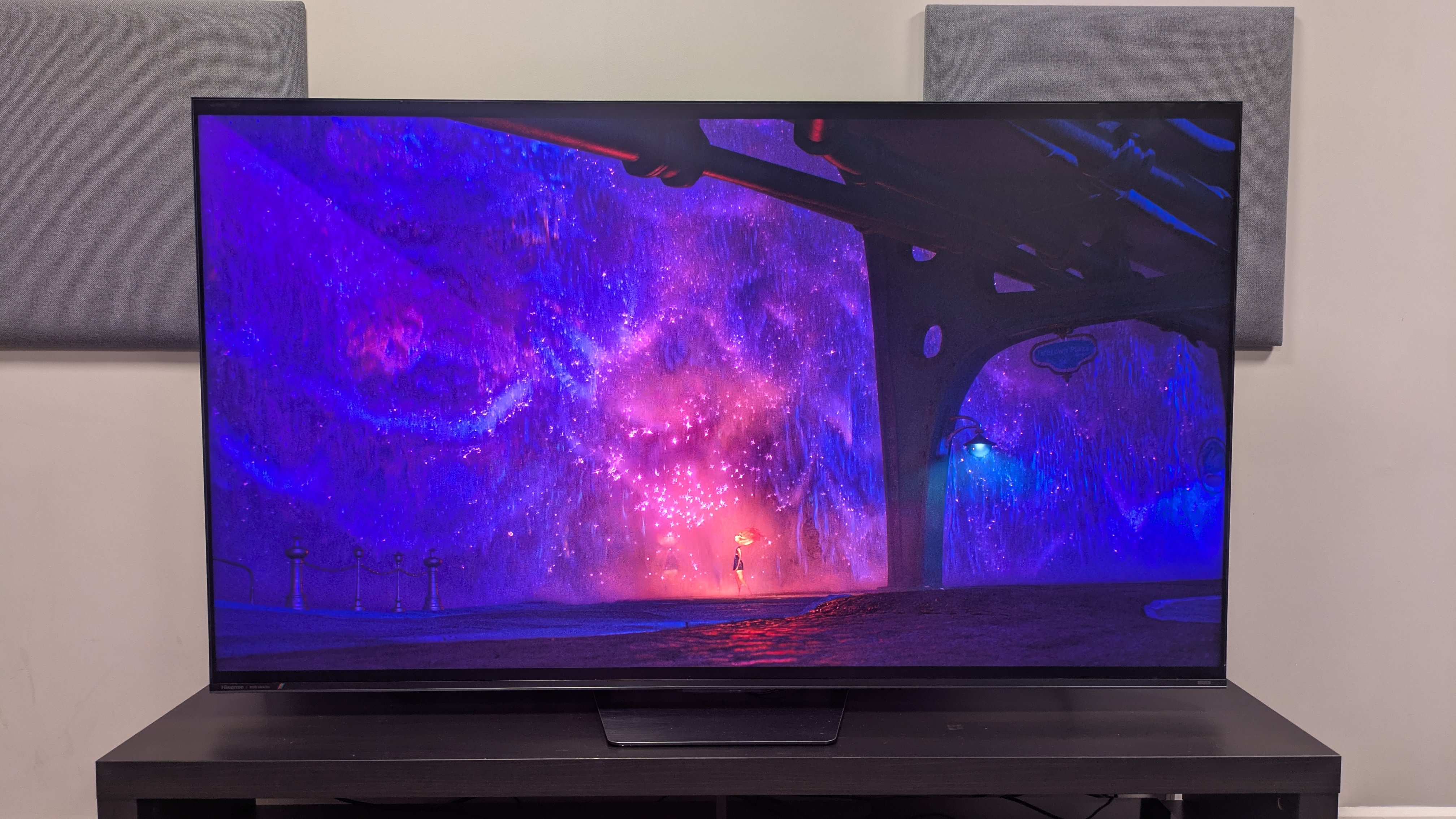 Hisense UR8 with purple waterfall from Elemental on screen. The purple looks vibrant and shiny, with impressive colors