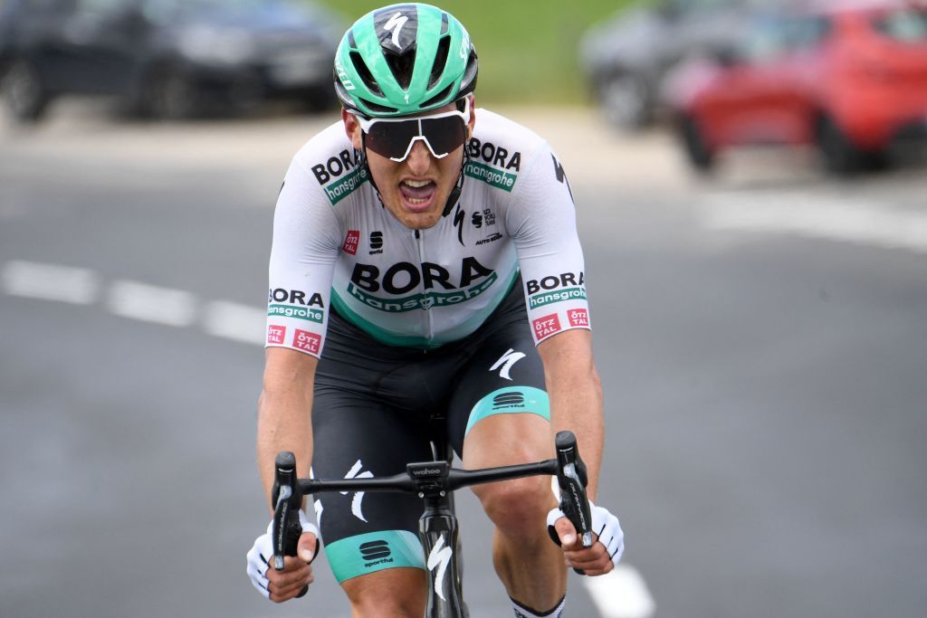 Stage leader Team Boras Lukas Postlberger of Austria rides during the second stage of the 73rd edition of the Criterium du Dauphine cycling race 173km between Brioude and Saugues on May 31 2021 Photo by Alain JOCARD AFP Photo by ALAIN JOCARDAFP via Getty Images
