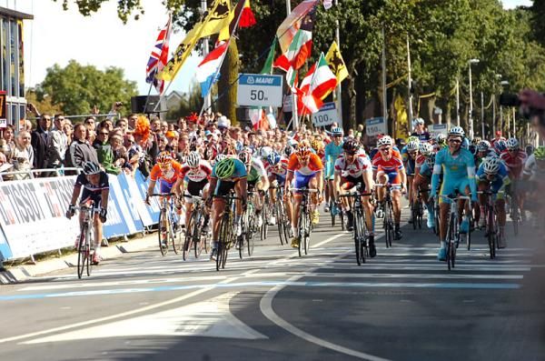 Alexey Lutsenko (Kazakhstan), right, timed his sprint to perfection and begins his victory salute.