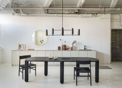 Dining table and kitchen,Inside Radnor’s new studio in Gowanus, Brooklyn.