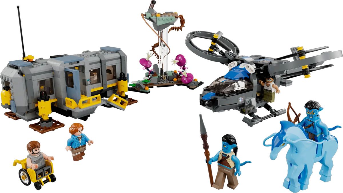 A collection of brick-built models including a little building and a helicopter as assembled next to each other.