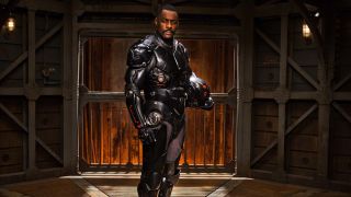 Idris Elba stands stoically while posing in his Jaeger uniform in Pacific Rim.