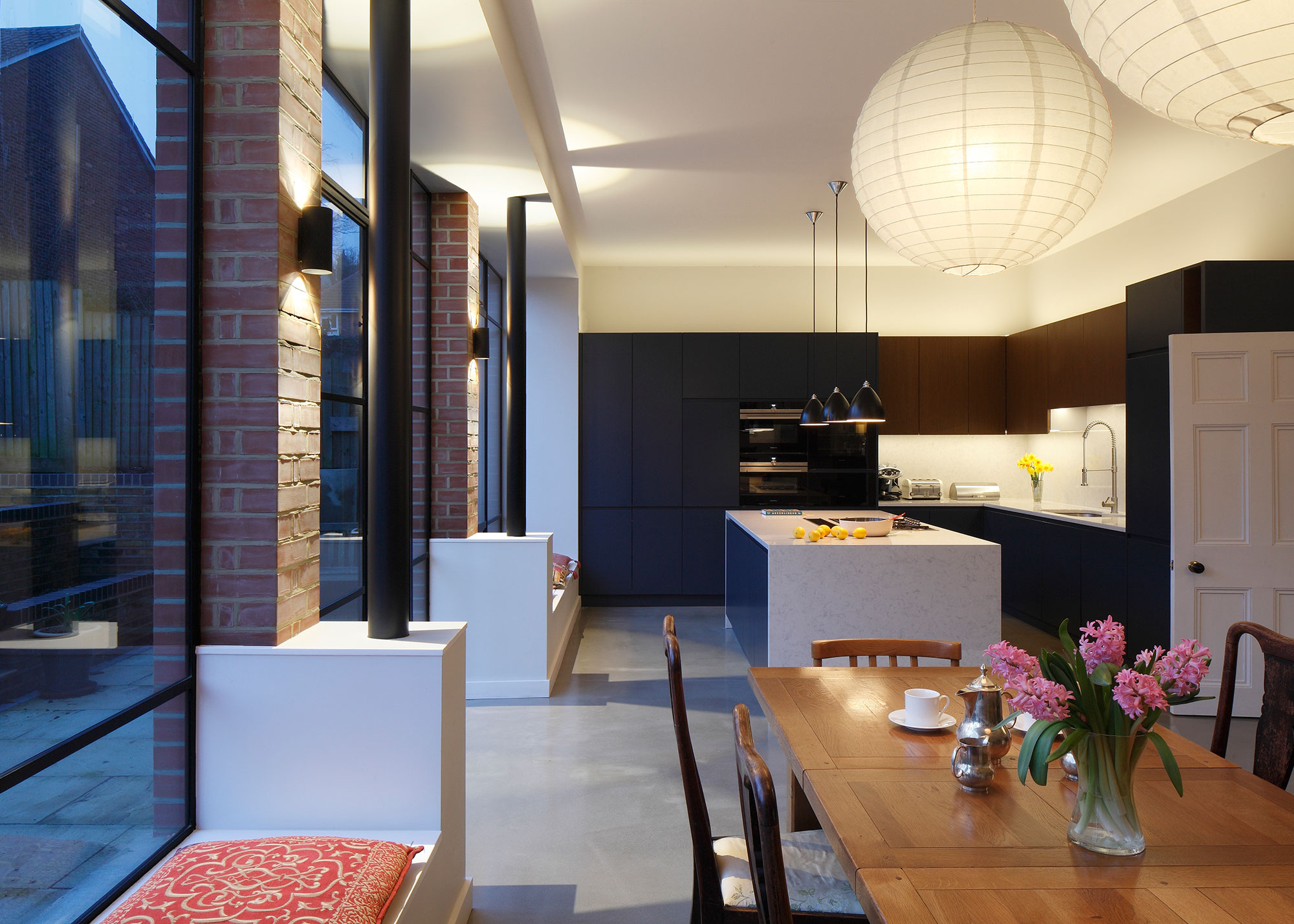 modern open plan blue kitchen diner with modern window seats