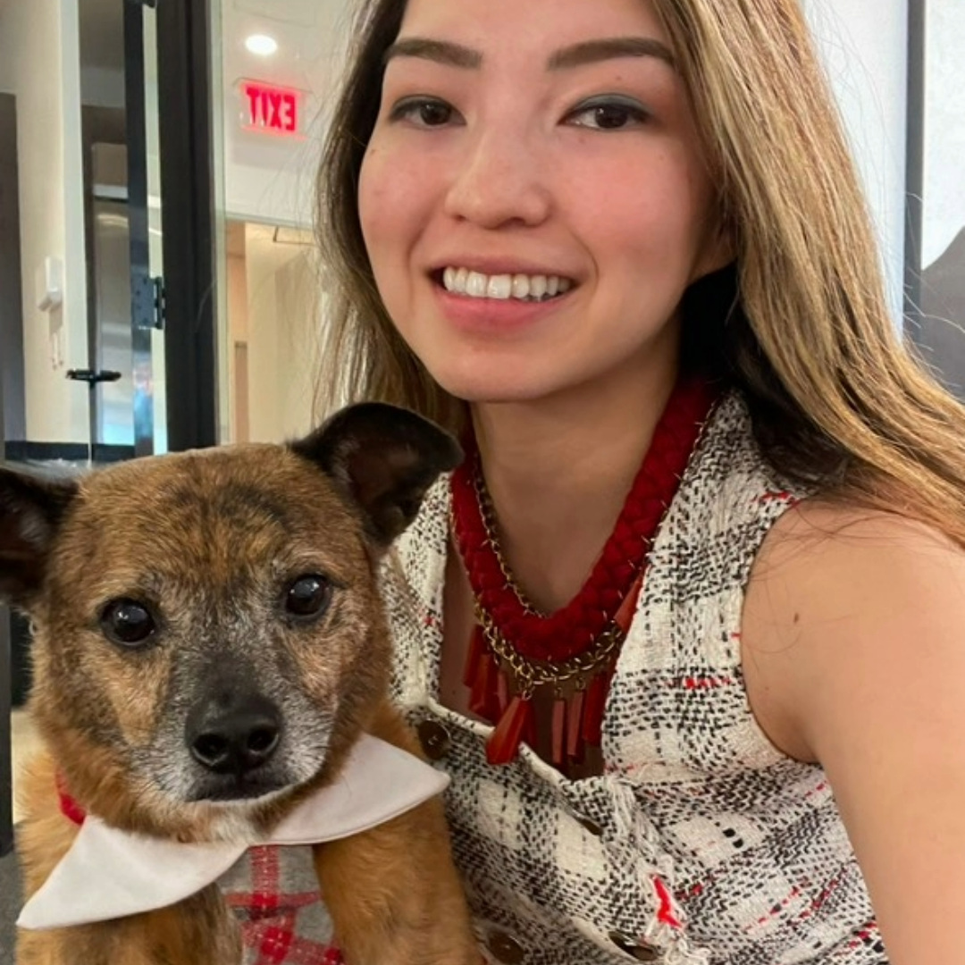 Sarah and Duke wearing matching red, grey and white tartan outfits