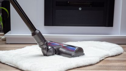 Cordless vacuum cleaner vacuuming floor