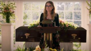 Kayla Cromer delivering a eulogy in front of a coffin in Everything's Gonna Be Okay.