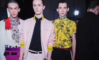 Models backstage Haider Ackermann fashio n show in his uniquely electic and vibrant collection